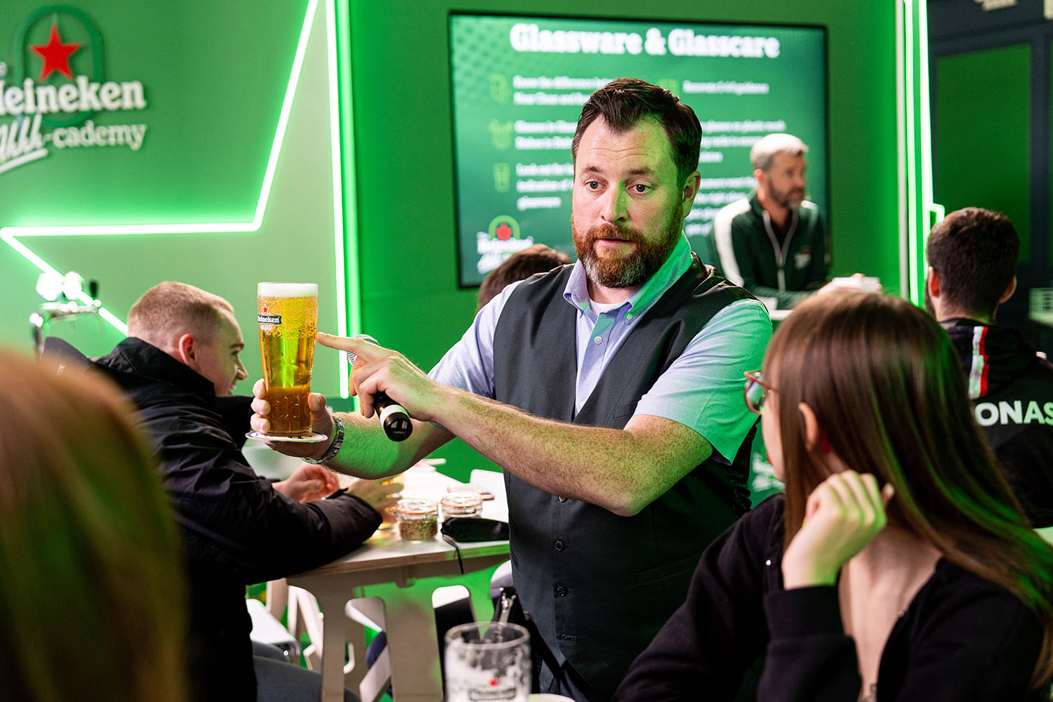 Facilitator demonstrating beer service to participants