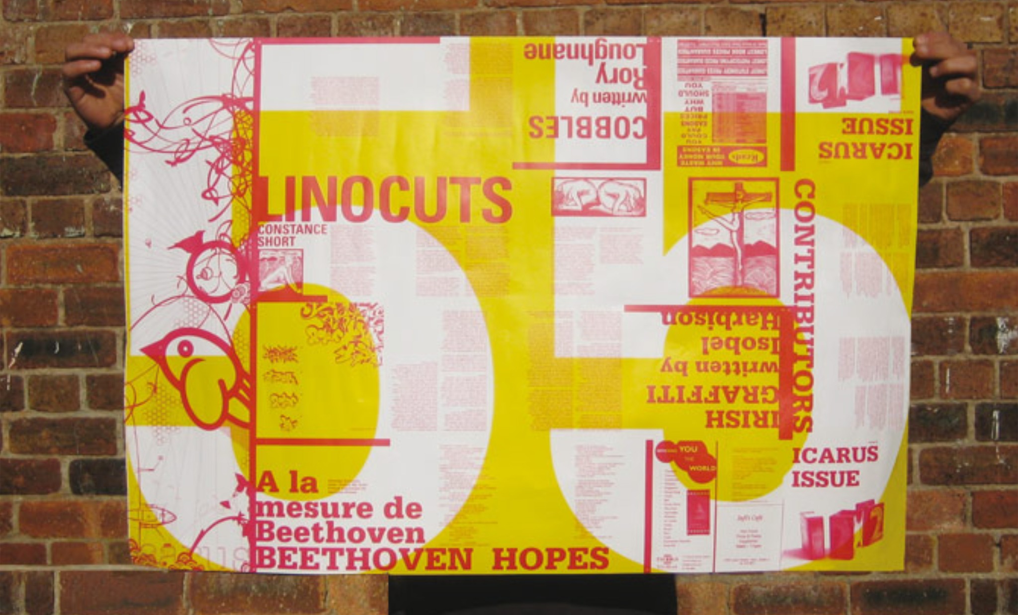 Icarus folding poster displayed against a brick wall